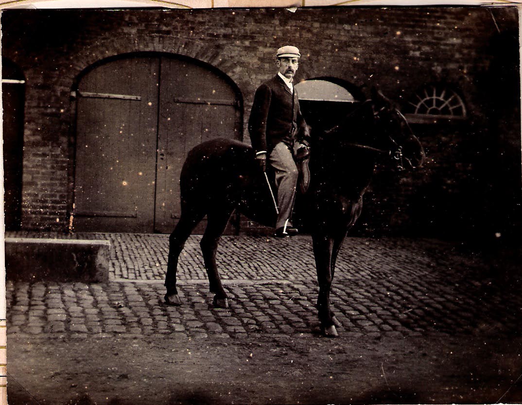 Robert John FARMER on Polly his horse in the stableyard at Marple