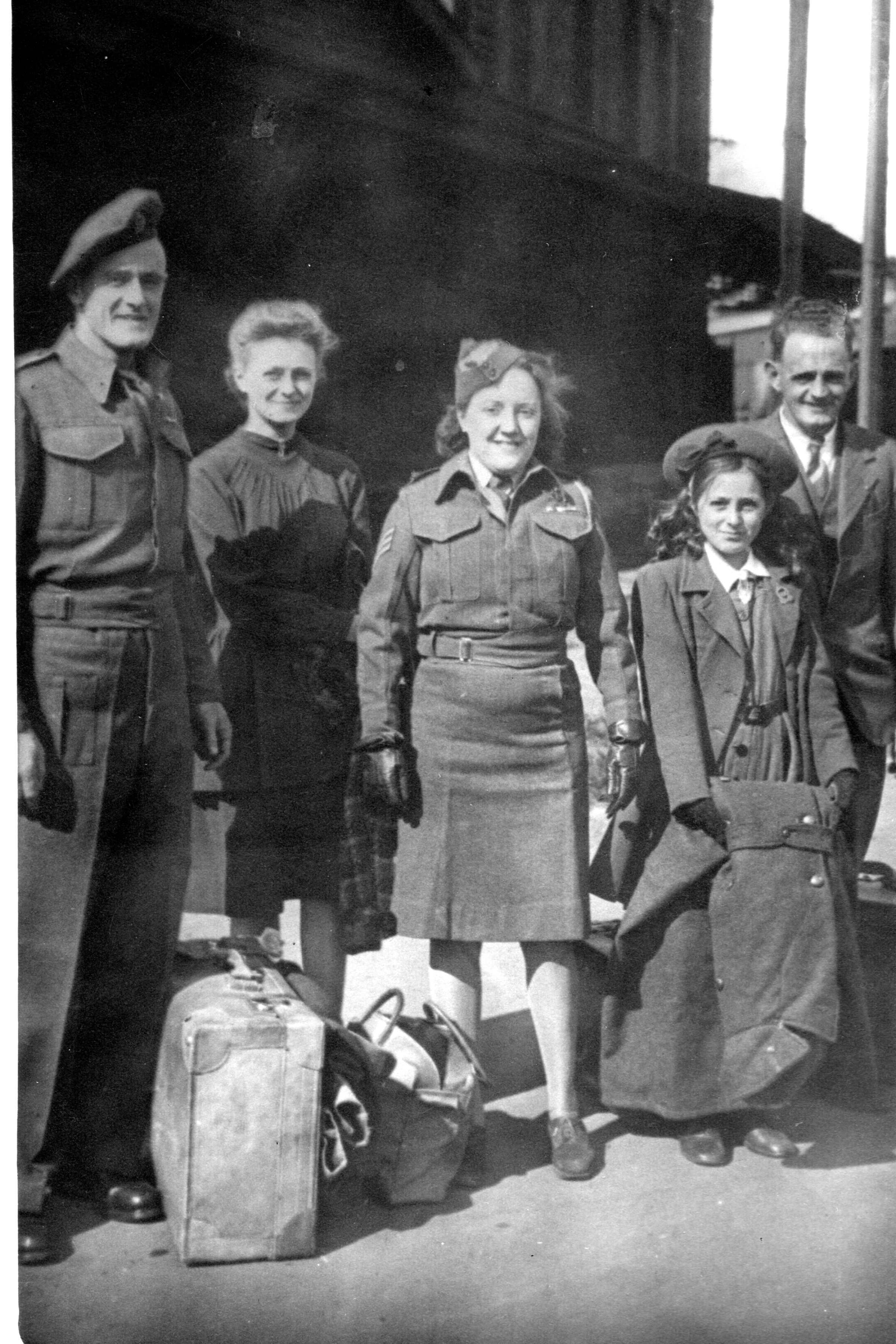 Phillip Thomas Clark, Beatrice Mary Clark, Aliston (Bert) and his two daughters – the blonde one is Phillis and the other is Pat.  It was taken the day that Phillip and Beatrice arrived in New Zealand on board the “Strathaird” which was the troop ship that bought them back from Egypt following the war – 7th September 1945.
